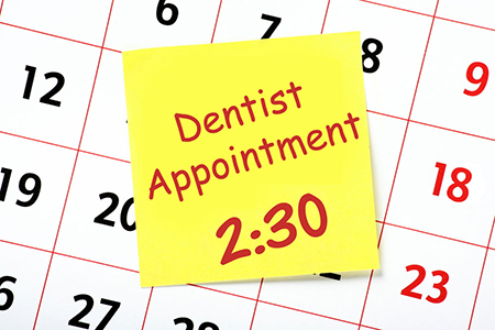 calendar with dentist appointment note on it