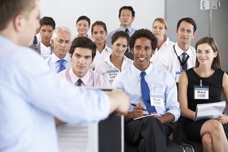 students listening to a guest speaker